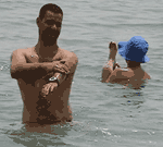 Bathers enjoying benefits of direct immersion in the Dead Sea